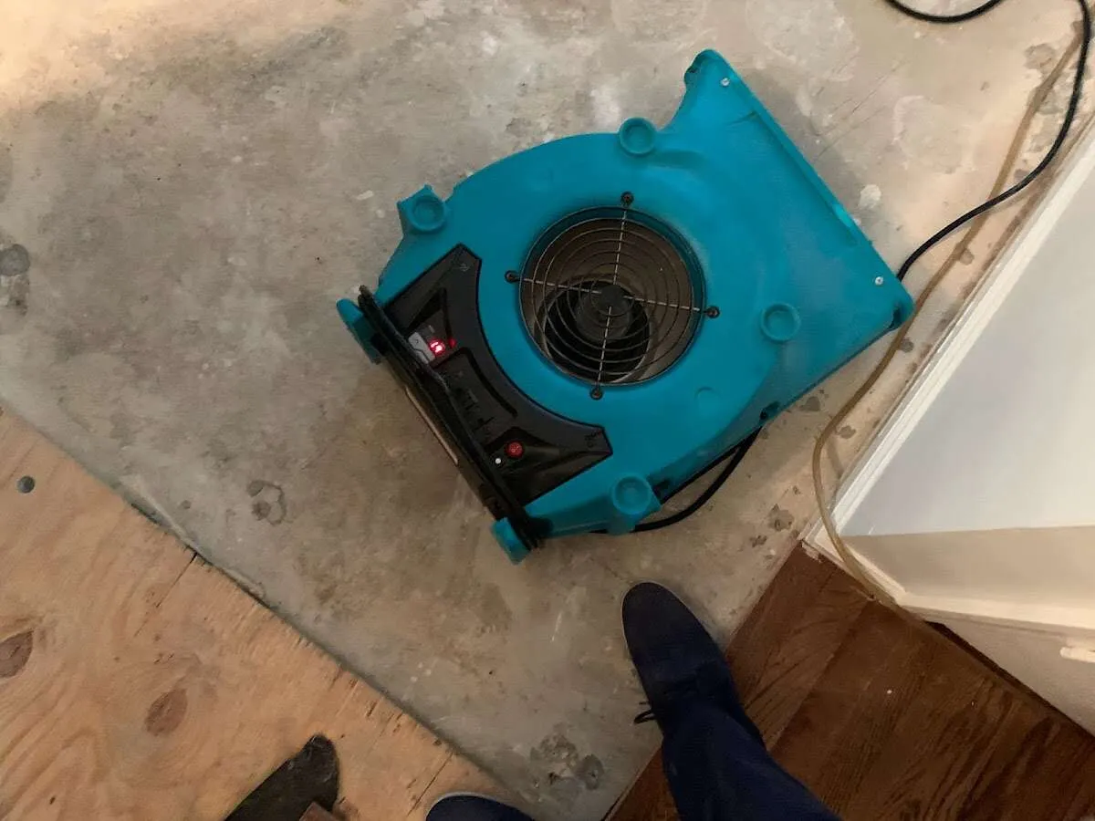 Air mover drying subfloor during Leak Detection & Repair in Bixby